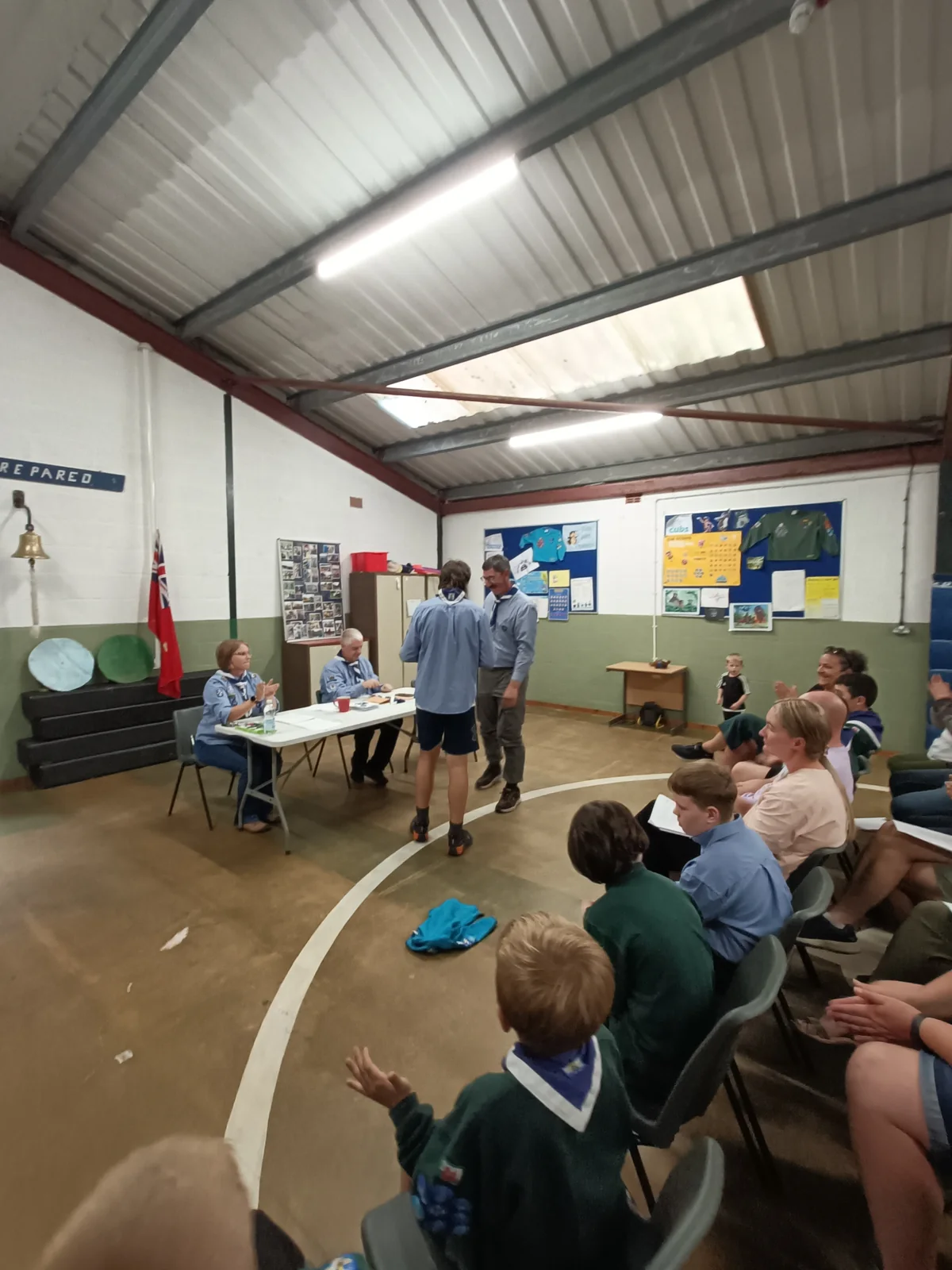 A group gathering inside the scout hut